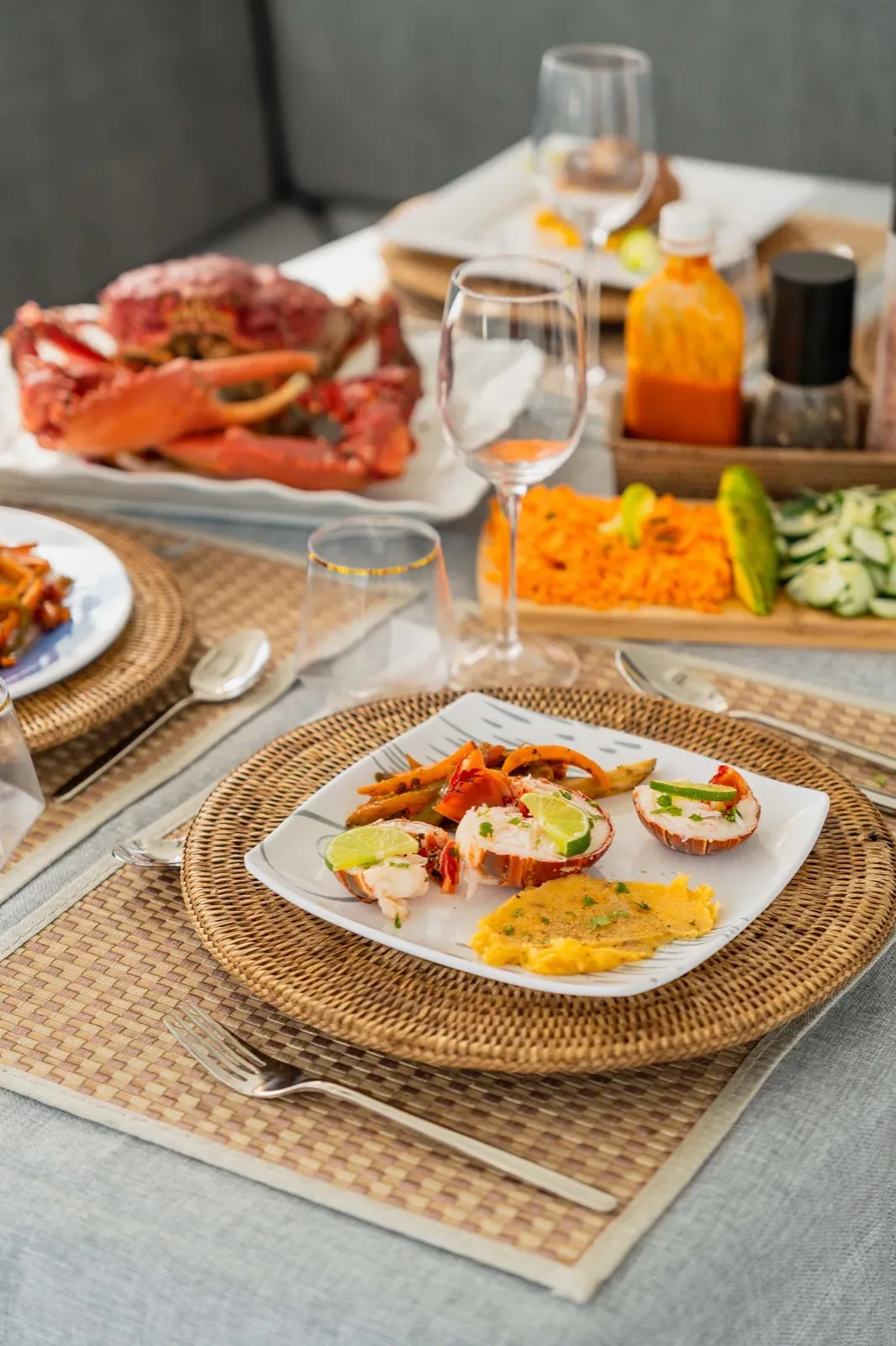 Lobster tail plated with crab and vegetables aboard the Lagoon 450