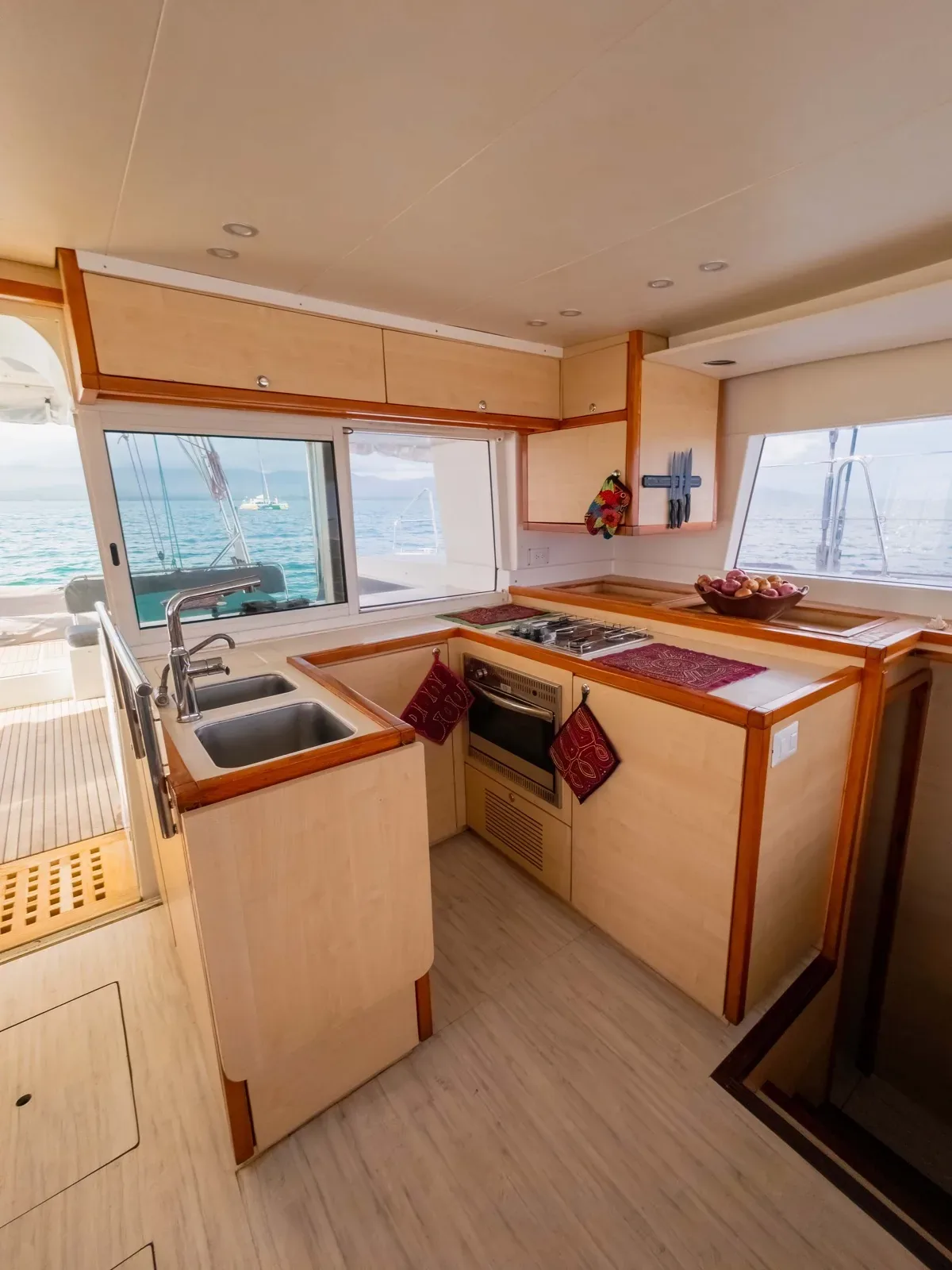 Galley aboard the Lagoon 450 with a double sink, oven and gas hob, refitted in 2025