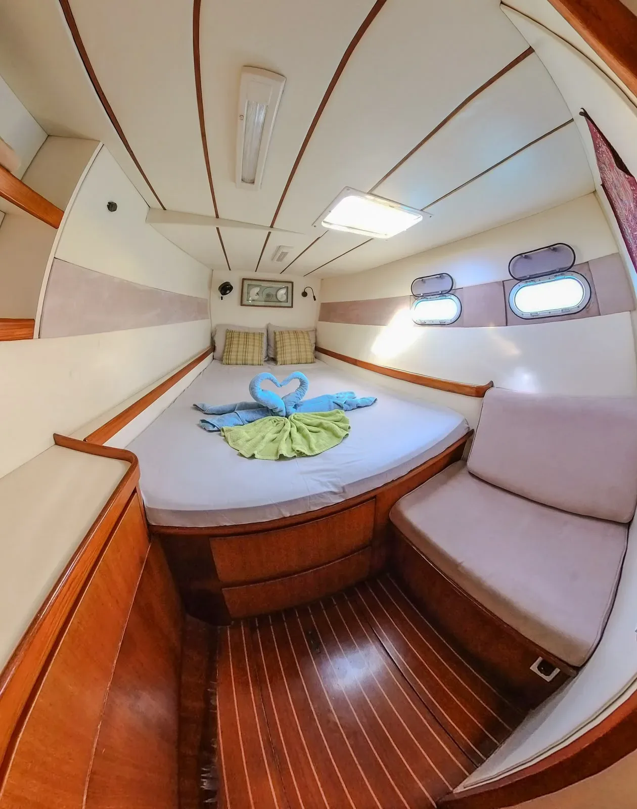 Double cabin on the Lagoon 55 with towels folded into swans and a private en-suite