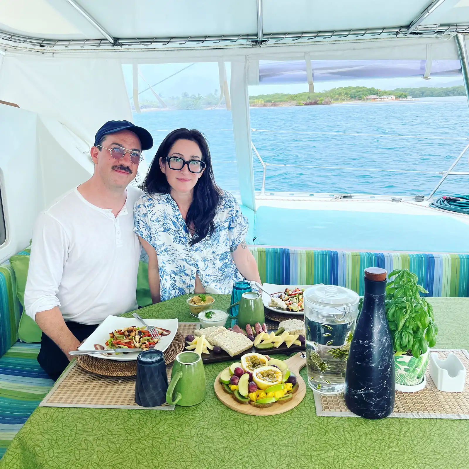 Lunch for two under the bimini on the Lagoon 55 with salads and fresh fruit