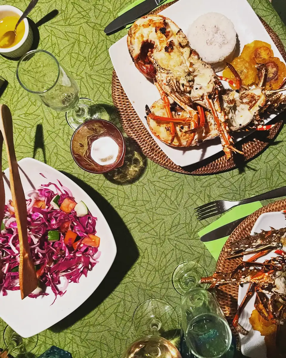 Lobster lunch served on deck aboard the Lagoon 55 with salad and fresh bread