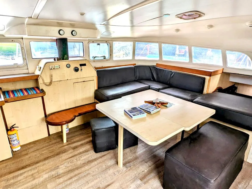 Saloon with dark leather seating around a large table
