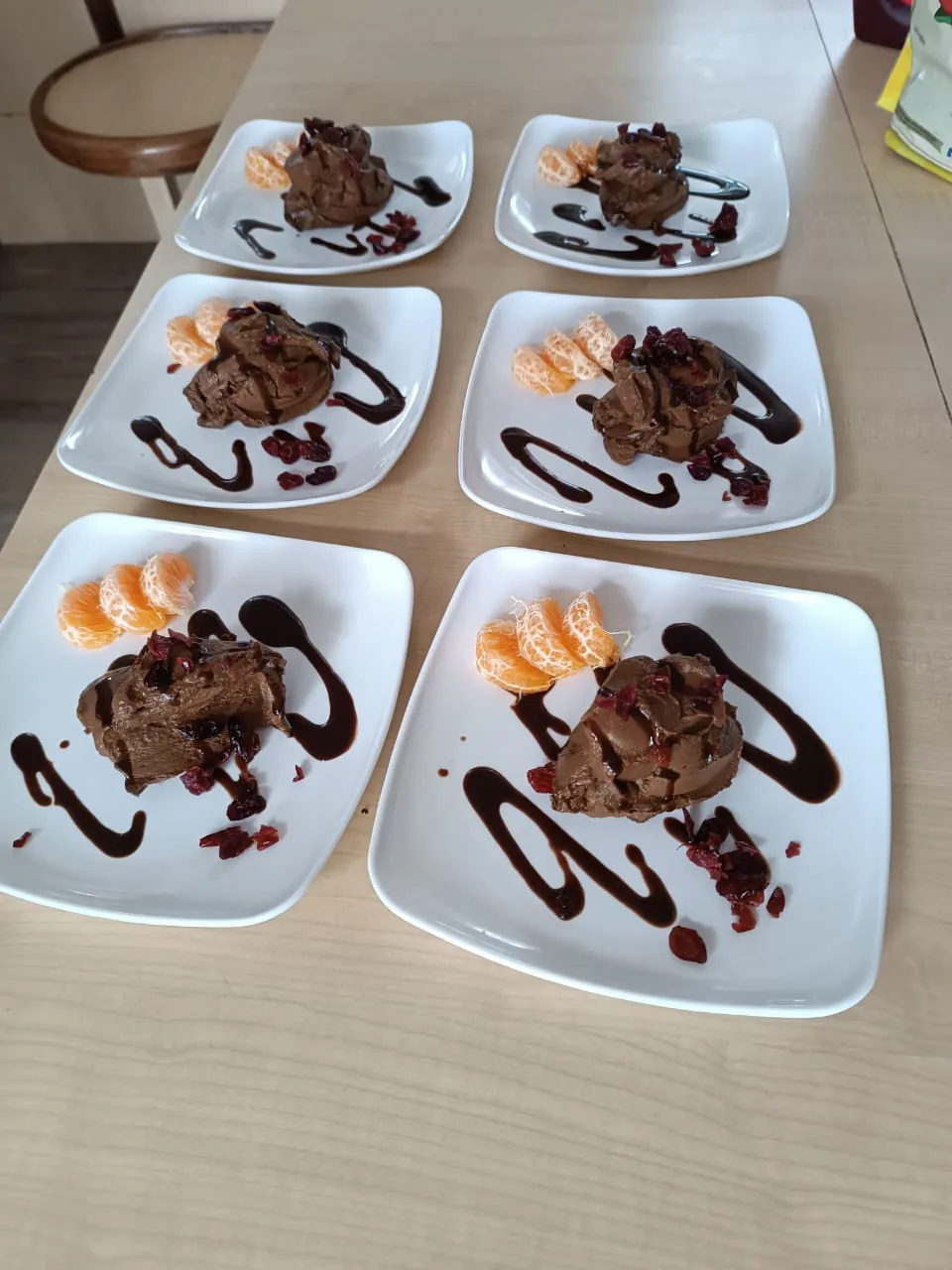 Chocolate desserts plated for six with fruit