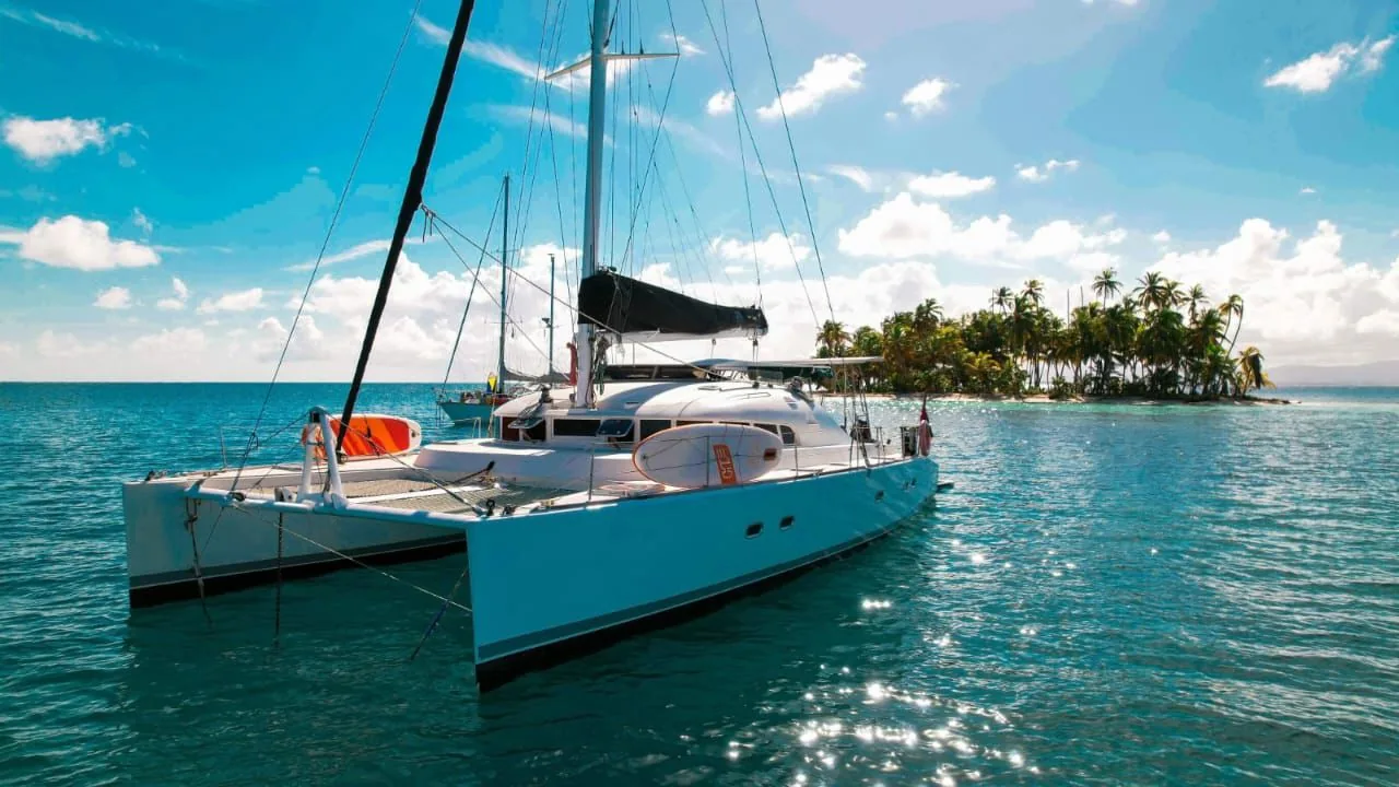 The Lagoon 52-G at anchor beside a palm-covered San Blas island