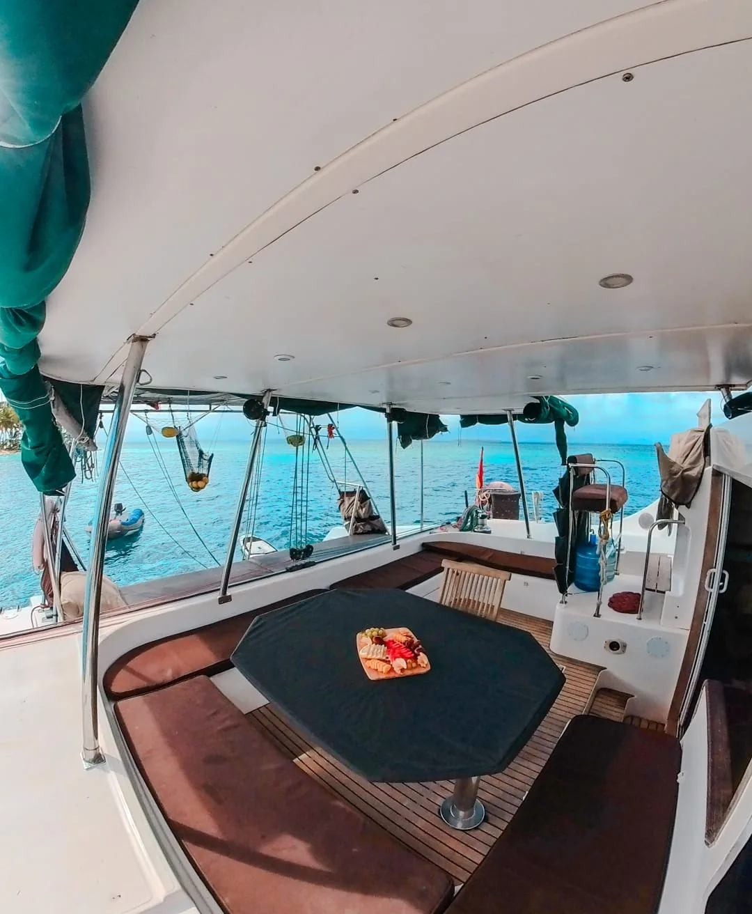 Cockpit table and cushioned benches under the hardtop
