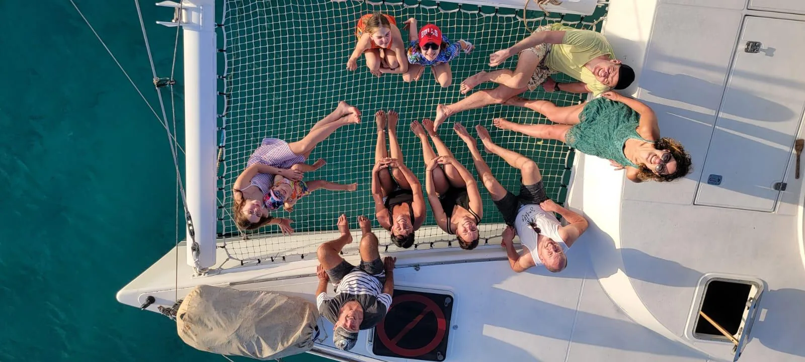 Guests lying on the bow nets, seen from above