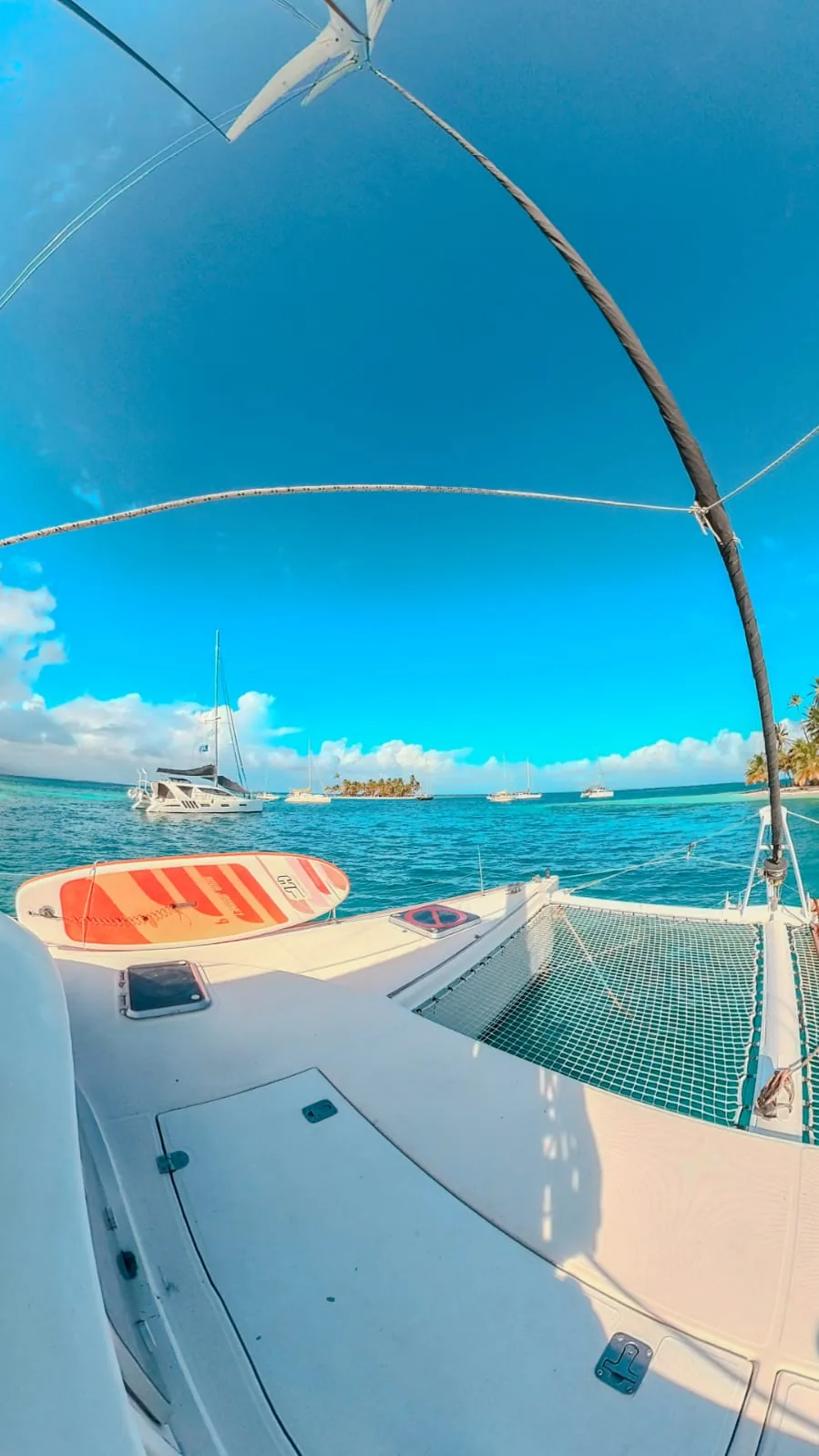 Foredeck with a paddleboard and the islands on the horizon