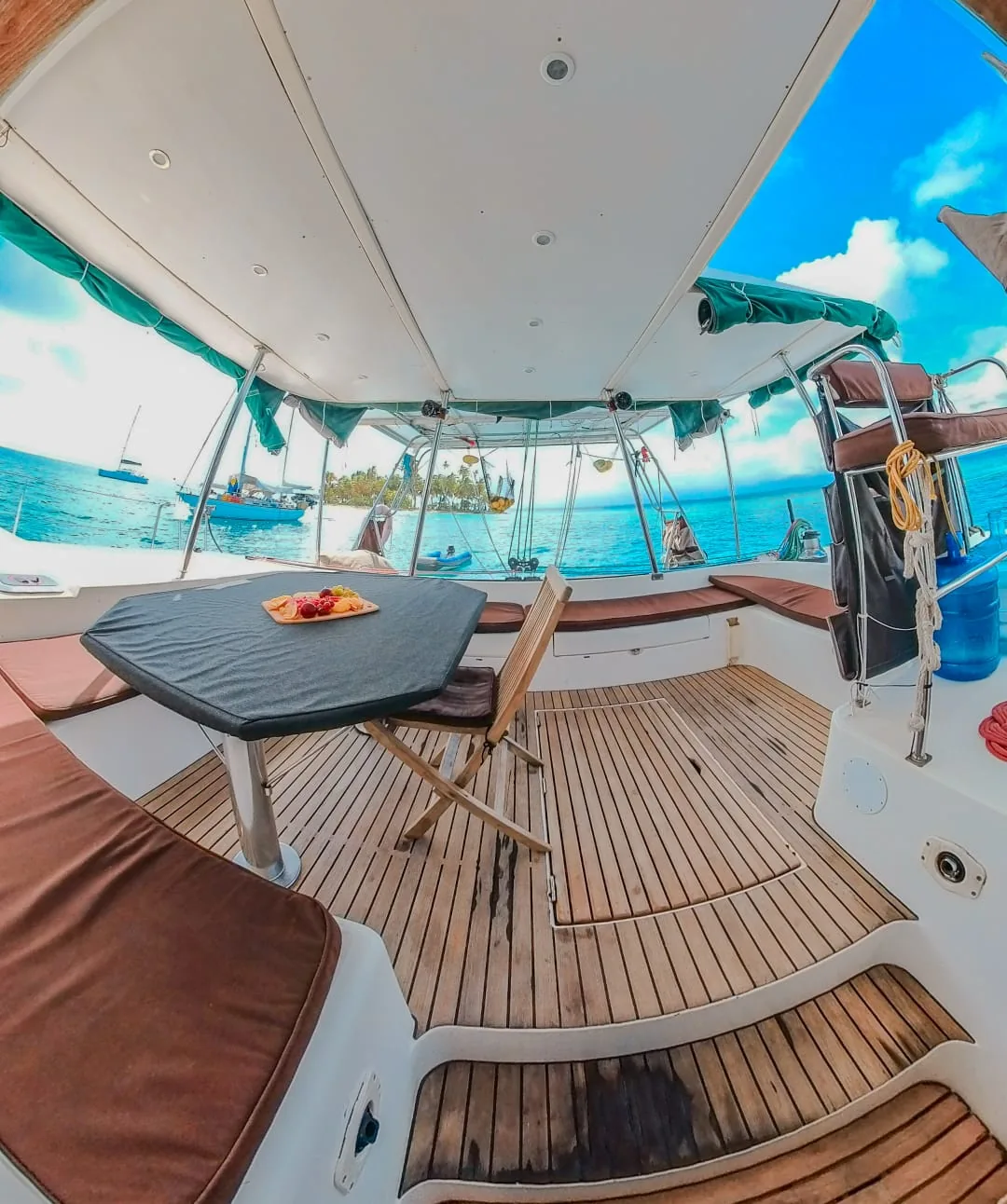 Shaded cockpit with the dining table and a fruit platter