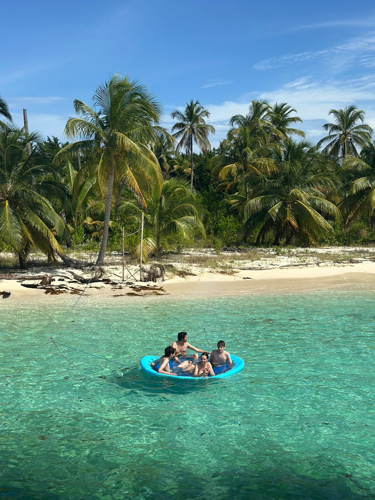 Guests relaxing in the shallows off a San Blas cay
